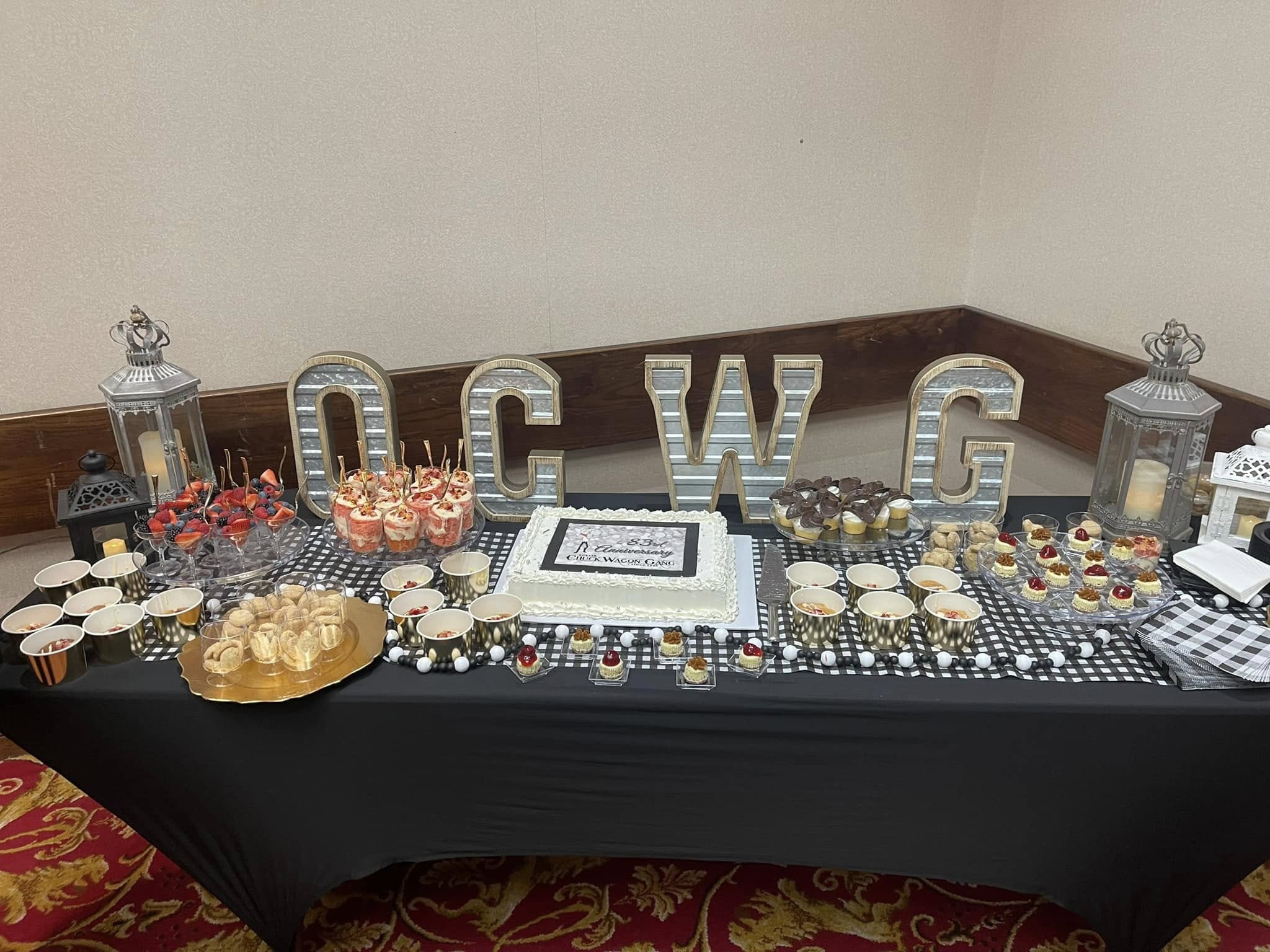 Assorted sweets on black tablecloth