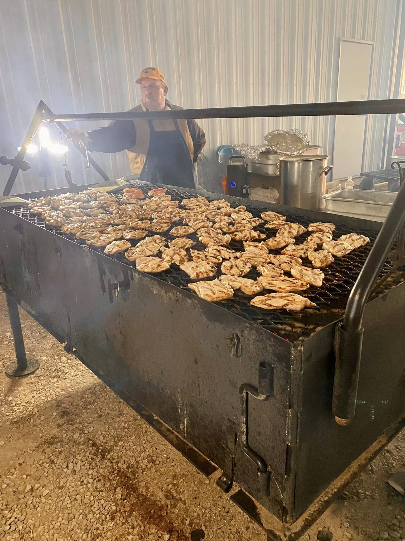Chef grilling chicken at an event