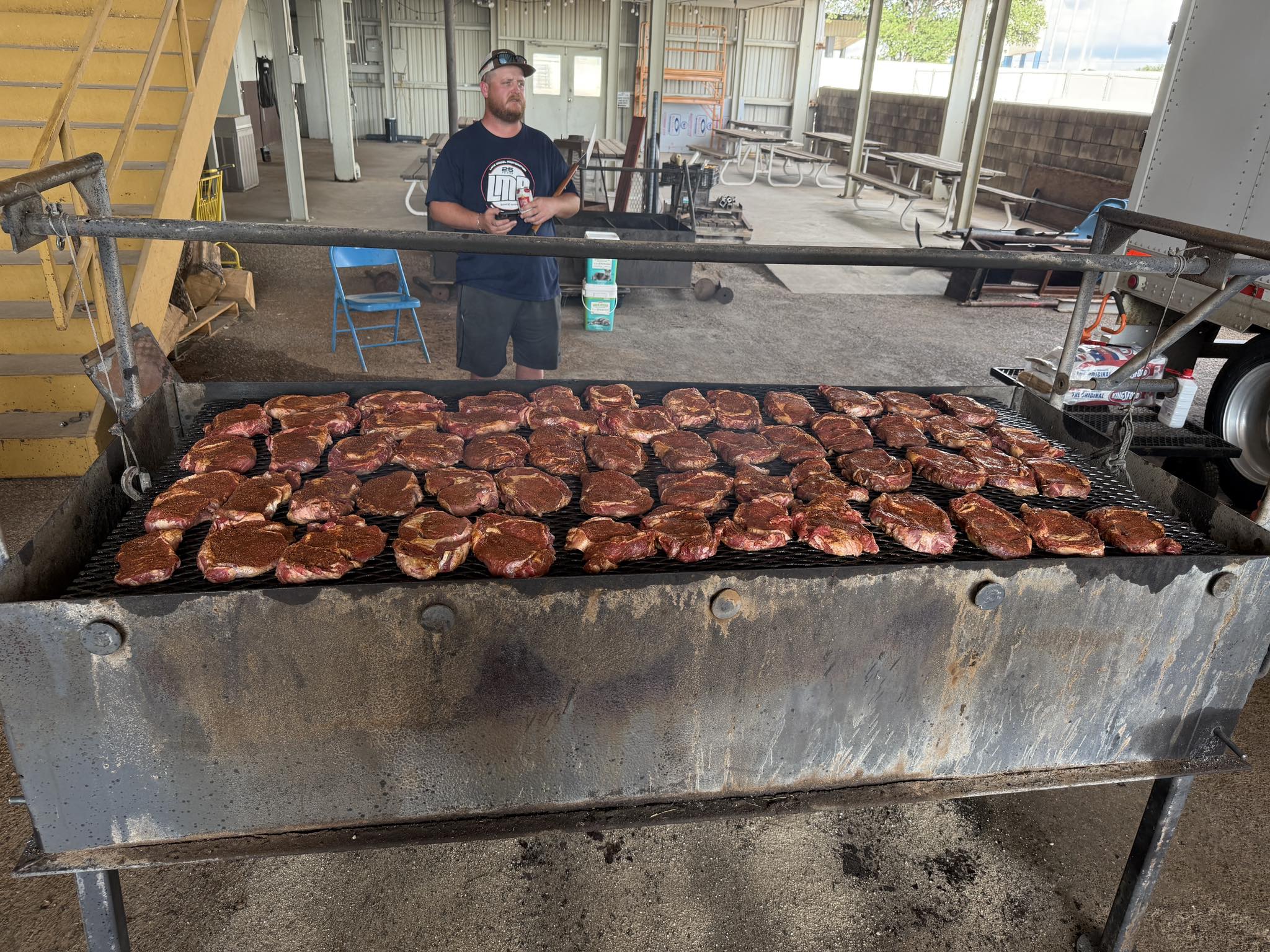 Barbecue scene with many steaks