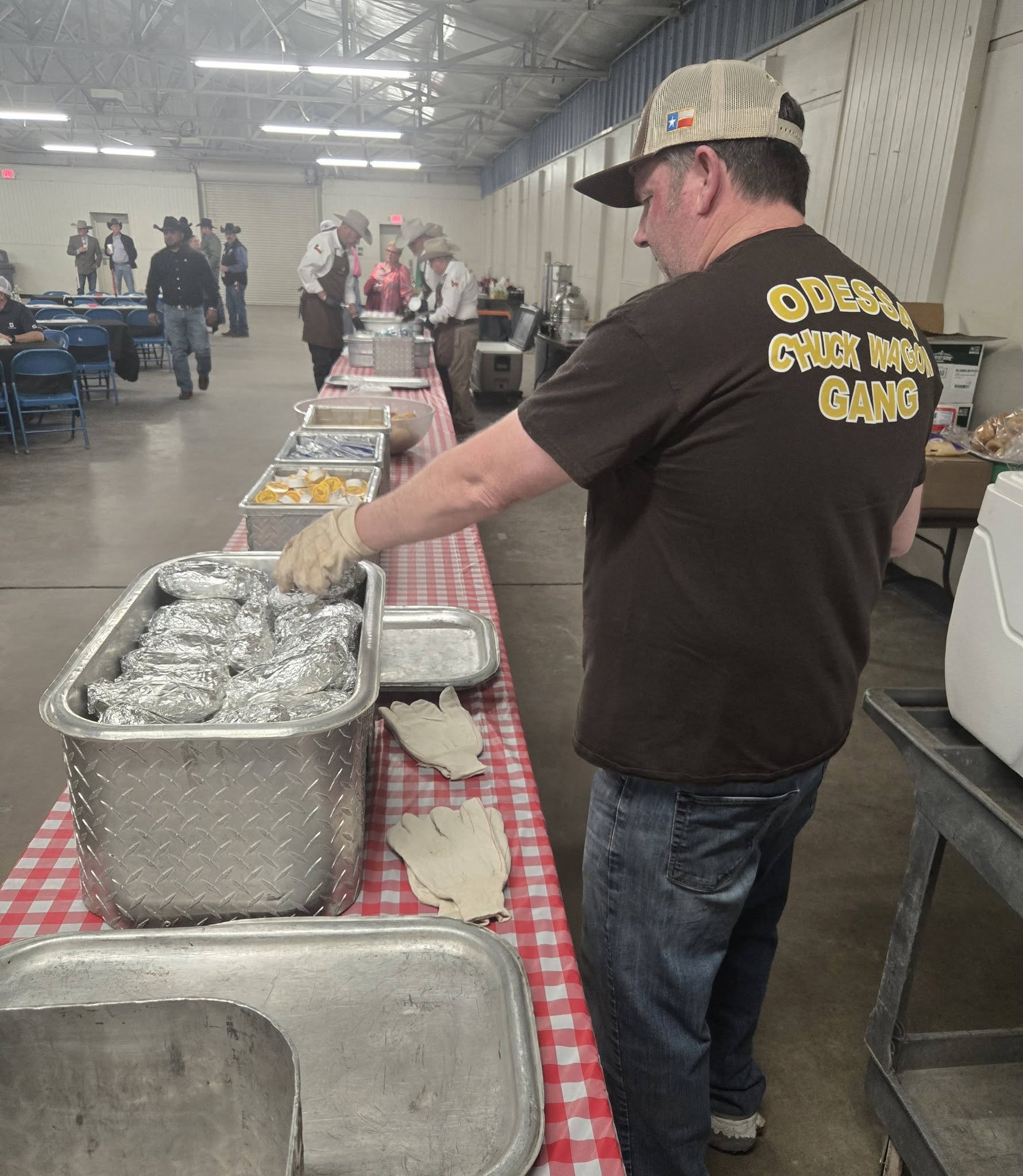 Volunteer preparing meals on checkered table