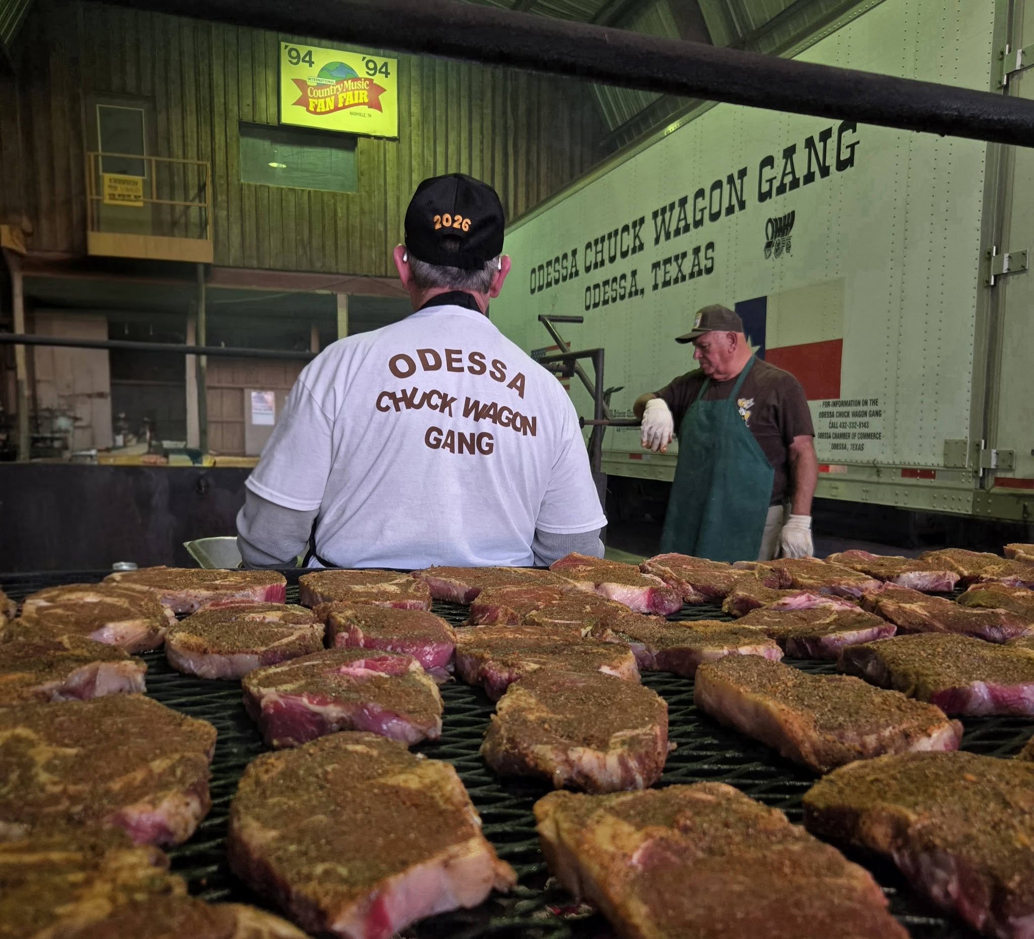 Grilling steaks at a barbecue event