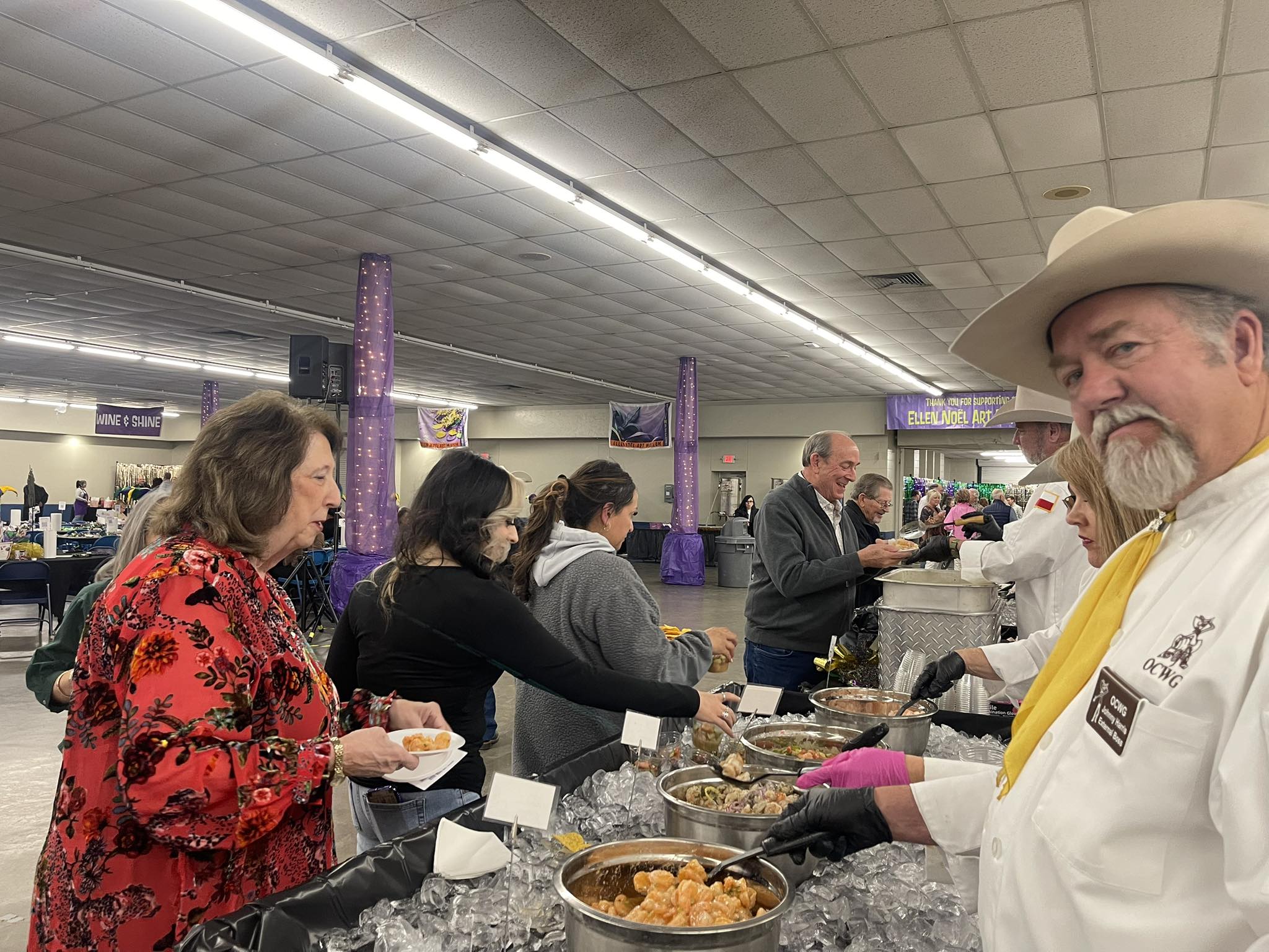 People serving food at buffet event