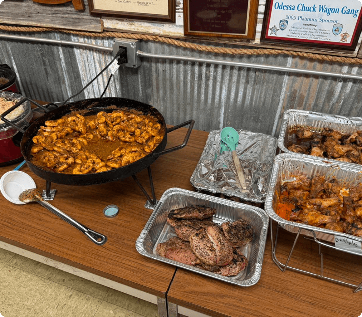 Assorted cooked meats on a wooden table.