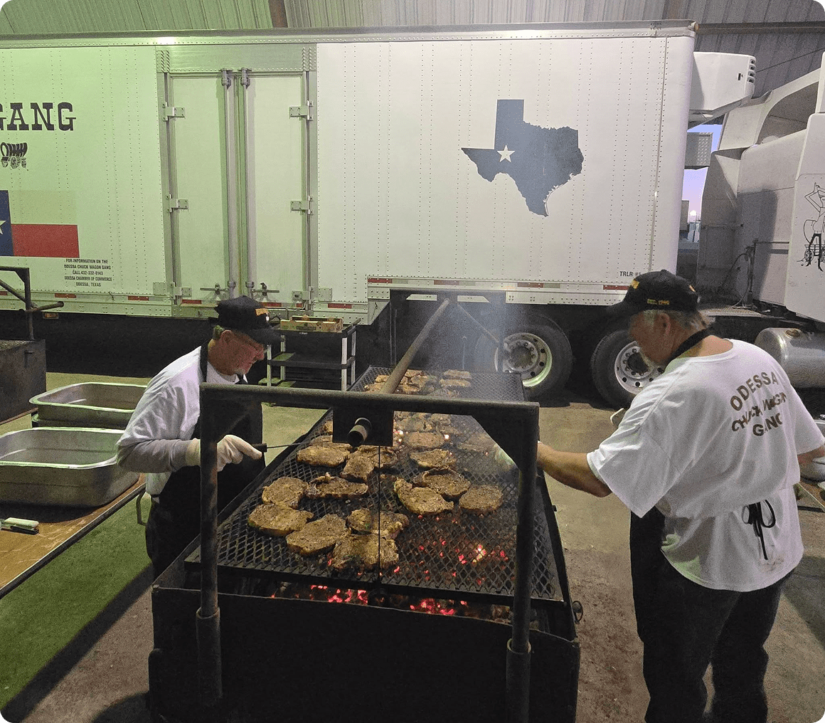 Outdoor barbecue with Texas backdrop