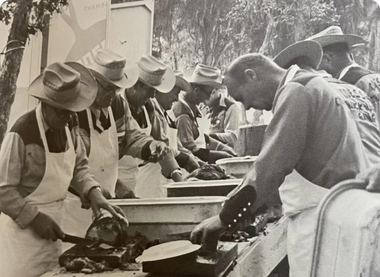 People preparing food at outdoor event