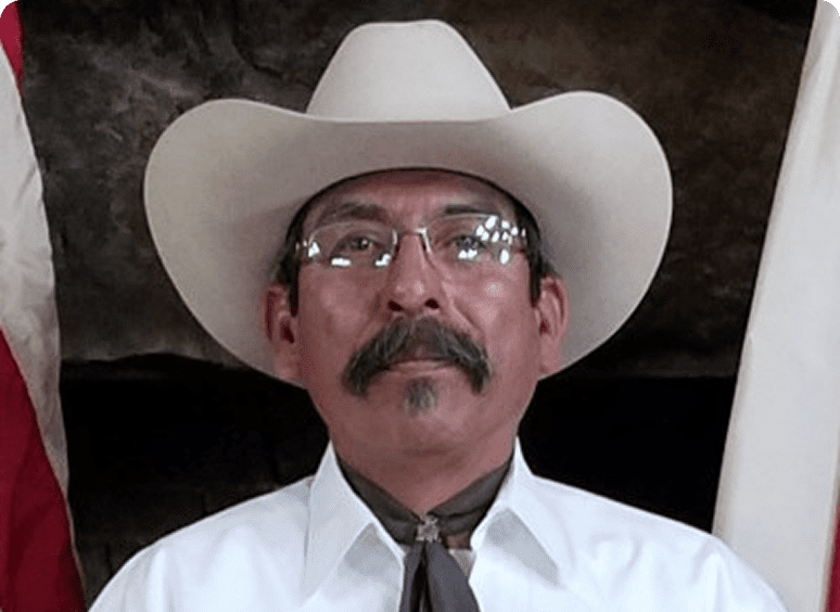 Man in white shirt with mustache