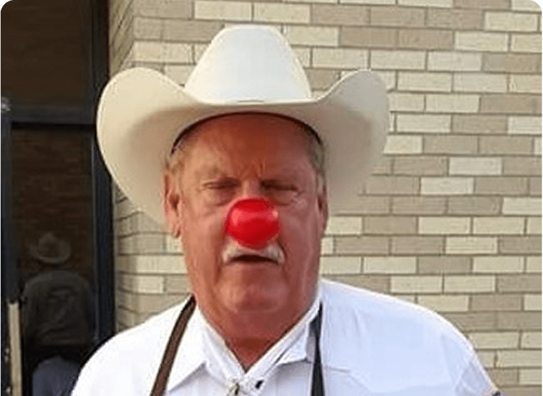 Older man dressed as cowboy clown