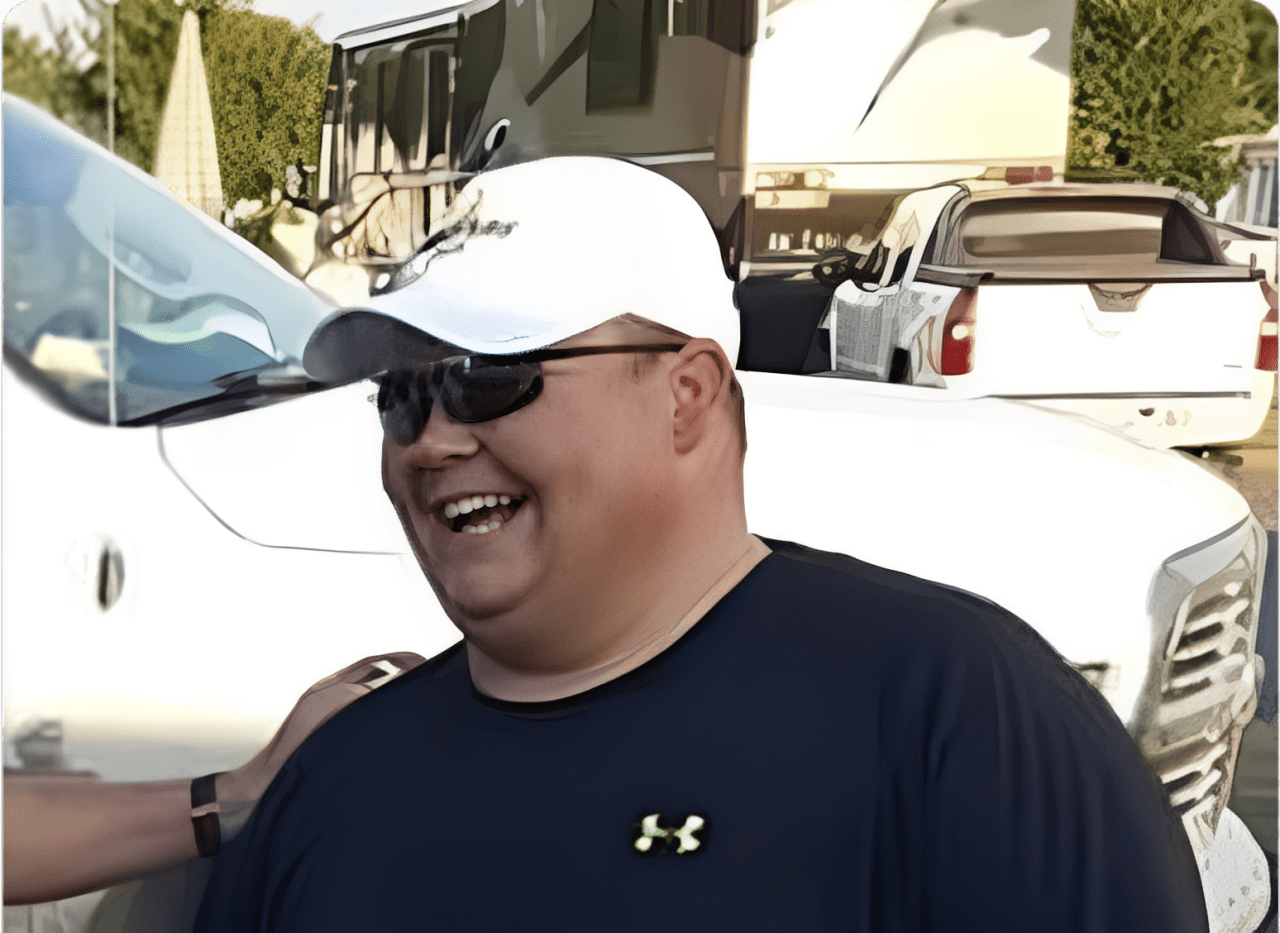 Person in sunglasses outdoors smiling