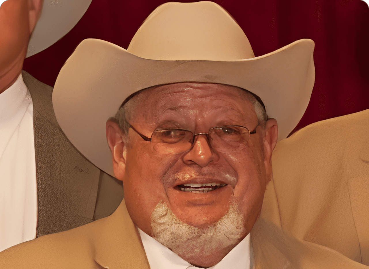 Man wearing cowboy hat and glasses