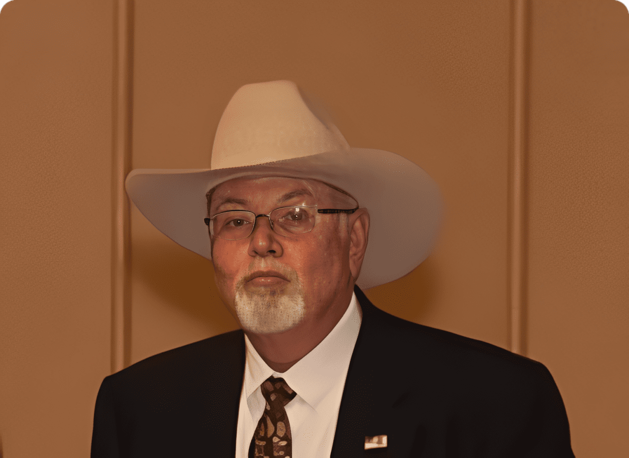 Man wearing cowboy hat and suit