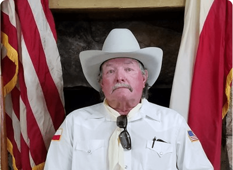 Man in cowboy hat with flags