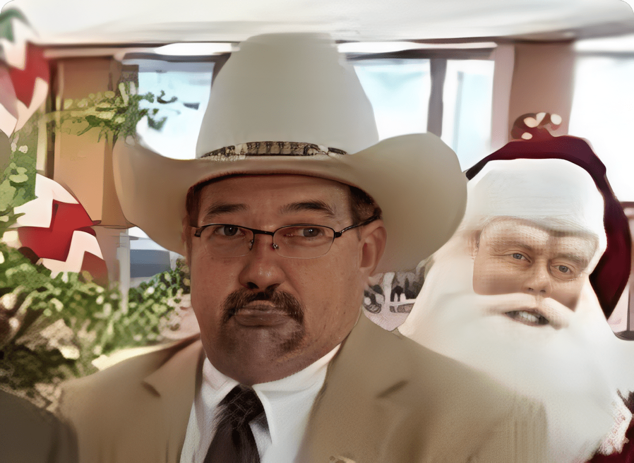 Cowboy hat man and Santa indoors