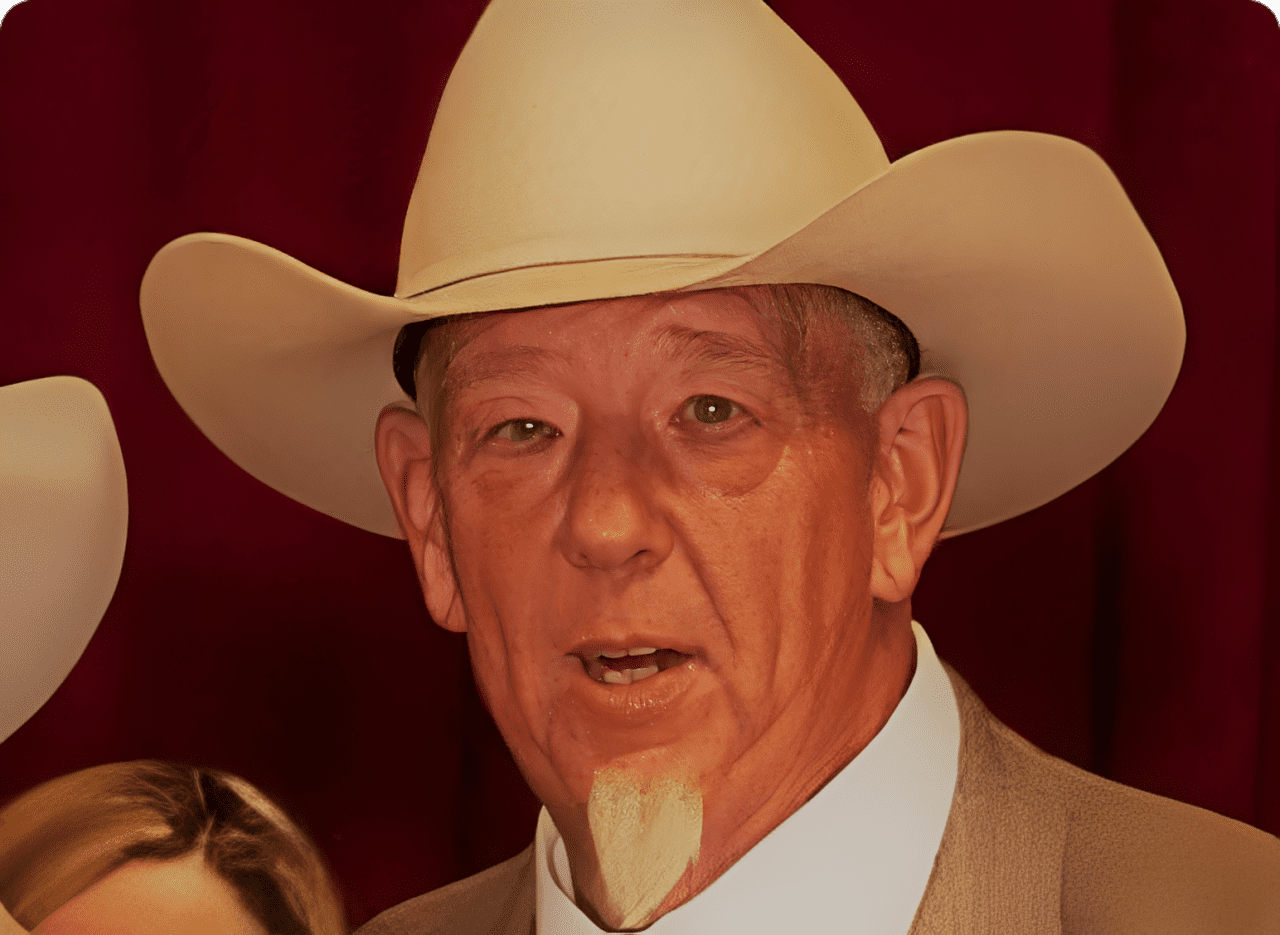 Man wearing cowboy hat and suit
